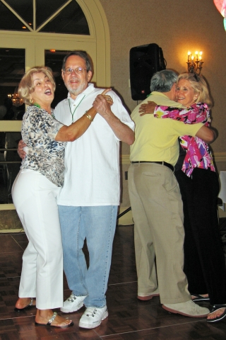 Shirley Hardman dancing with Neal Friedman and Harry Eng dancing with Jackie Stern.