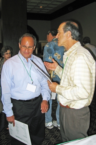 Mickey Hoffman having a discussion with Richard Kriozere.